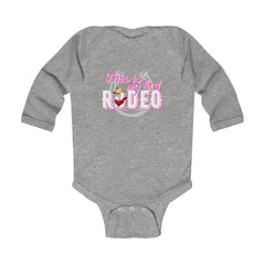 (First Rodeo Cowgirl) Infant Long Sleeve Bodysuit